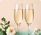 Two festive glasses and white flowers.