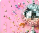 A disco ball and colourful confetti.